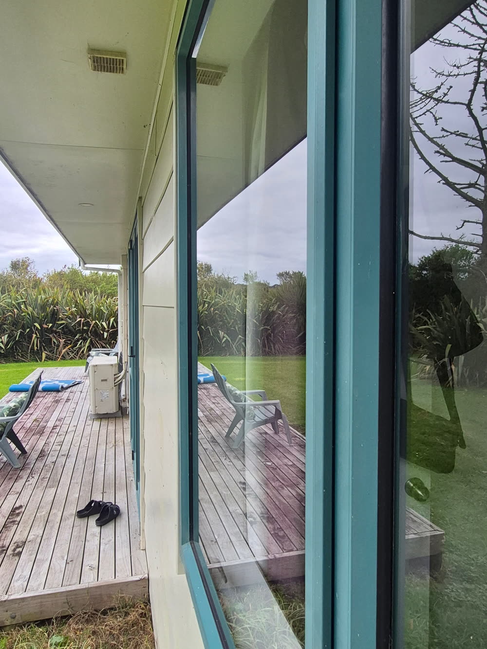 Spotless residential sliding glass doors looking onto a deck, West Auckland